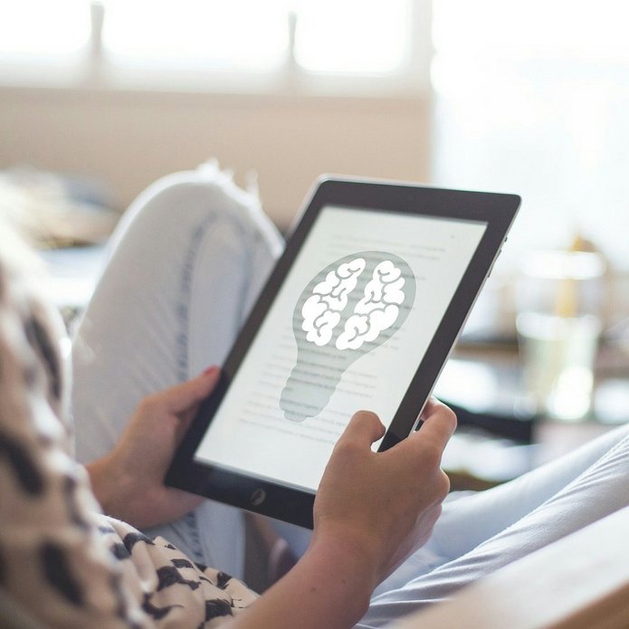 A person holding a tablet