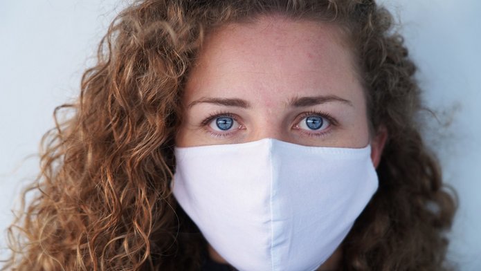 a woman wearing a protective mask