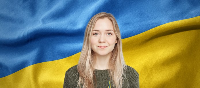 A woman against the background of the Ukrainian flag