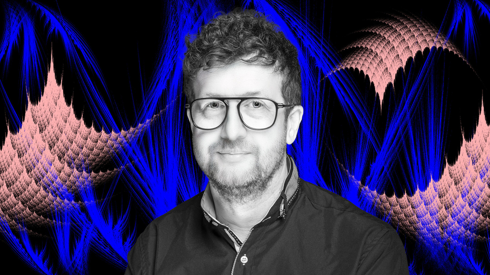 Prof. Dariusz Wardowski on a colorful background with fractals Prof. Dariusz Wardowski on a colorful background with fractals 