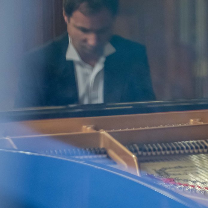 a musician playing the piano