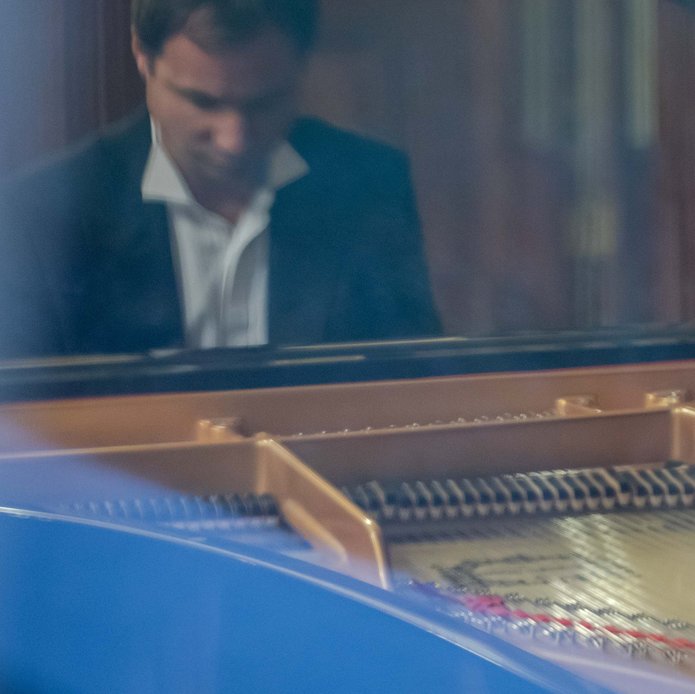 A man playing the grand piano