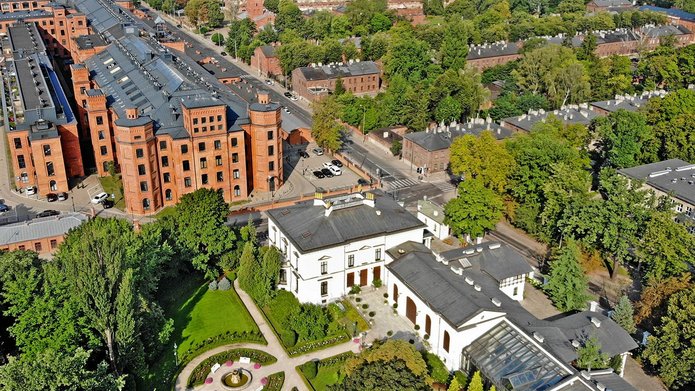 Lodz from a bird's eye view, with Herbst Palace and green areas in the frame