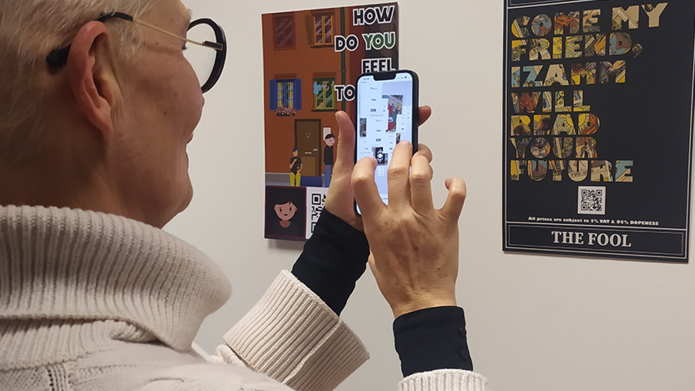 A person scanning a QR code with a phone