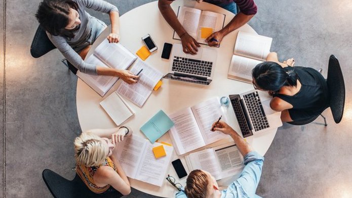 a decorative element: sitting at a table and studying students