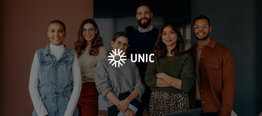 a group of smiling people of different skin colours