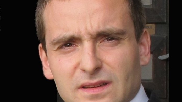 a man wearing a white shirt and a jacket