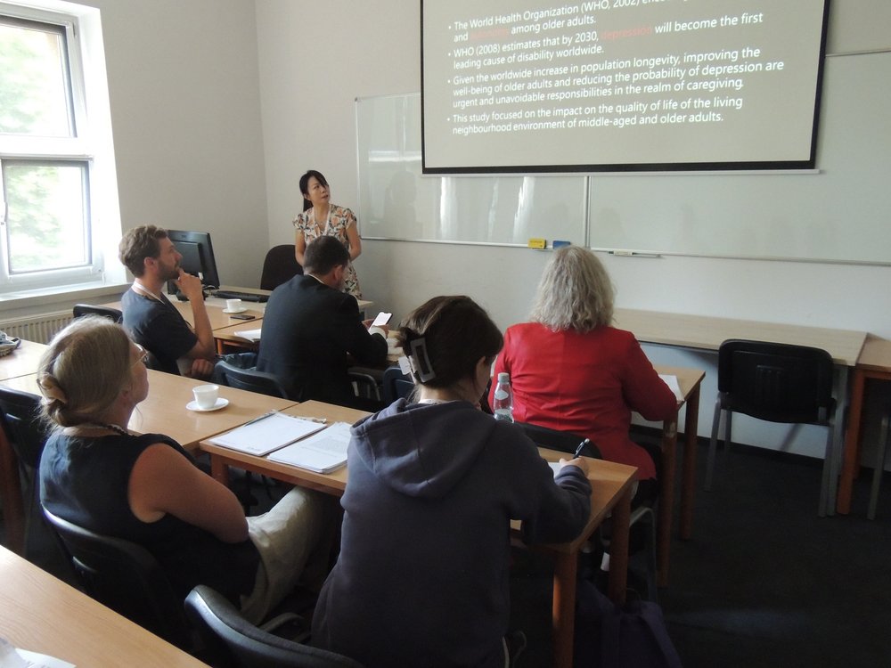 The conference participants in a lecture hall during a reading 