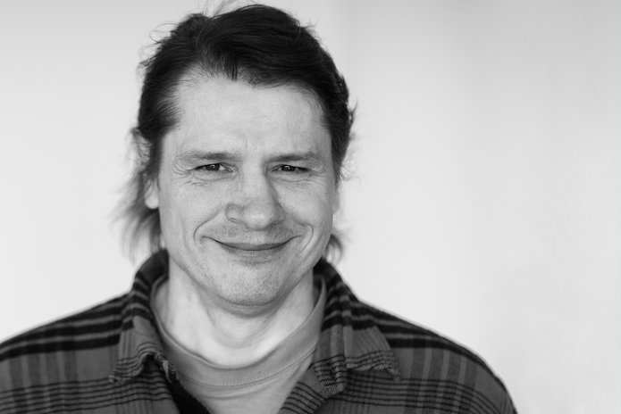 a black and white photo of dr Miguel Alexiades