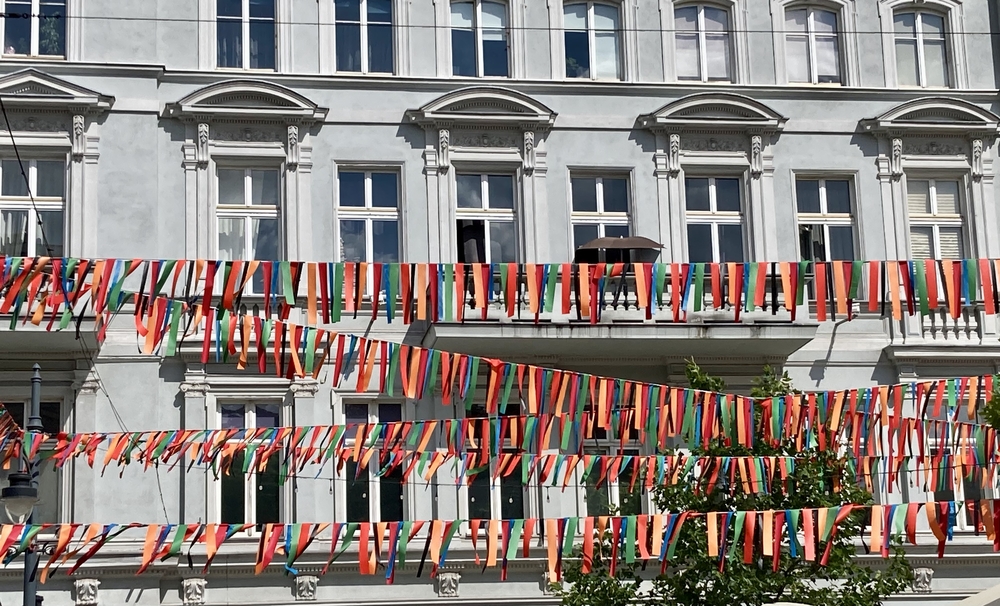 flags on the background of a tenement house