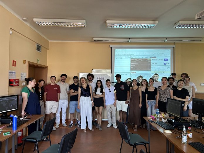 a group of students standing in a lecture hall
