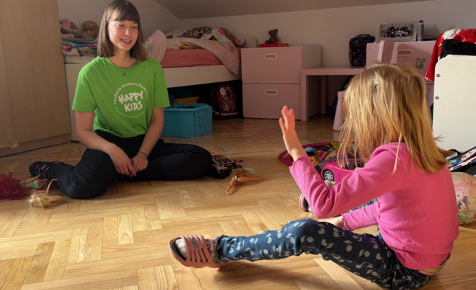 Psychology student, Maja spending time with Maja, a child under care of Happy Kids