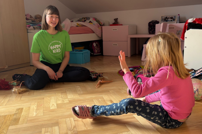Psychology student, Maja spending time with Maja, a child under care of Happy Kids