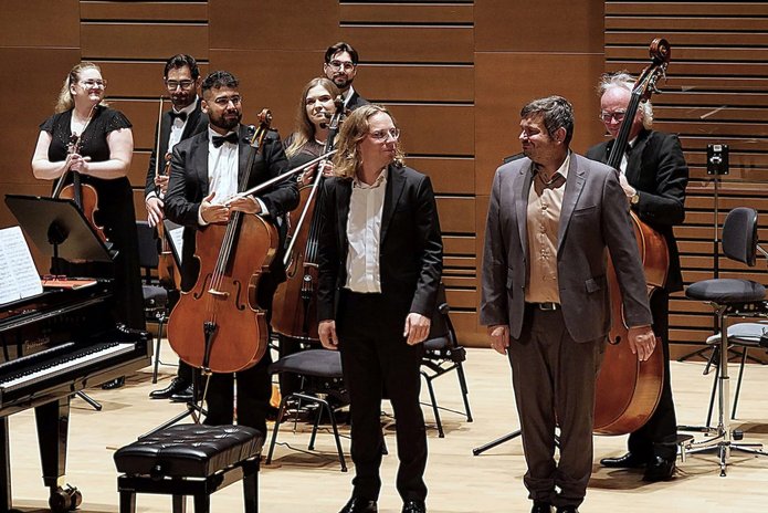 The piano duet in a concert hall