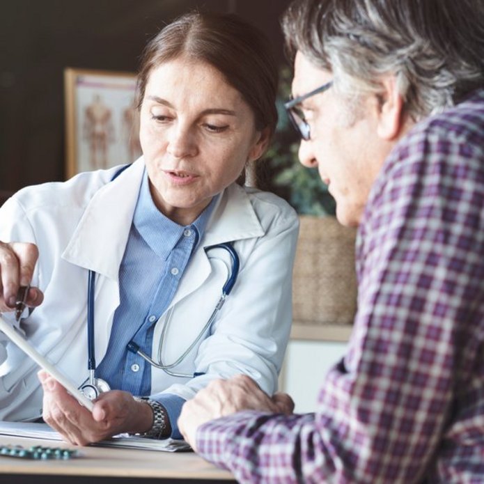 A decorative element: A doctor analysing patient's results on tablet