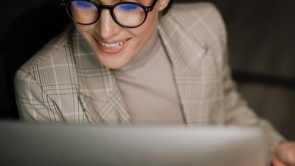a decorative element: a woman looking at the computer screen