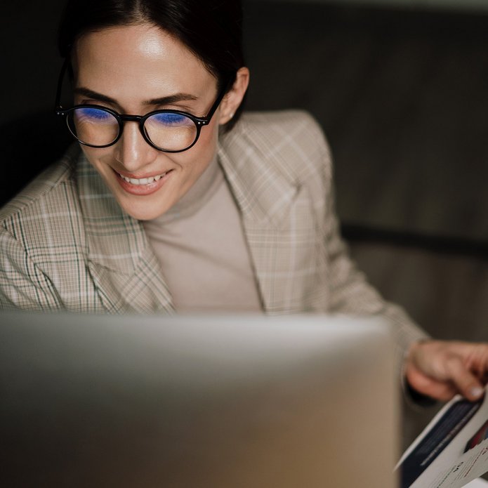 a decorative element: a woman in front of a computer screen