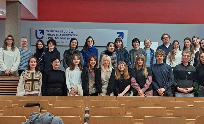 A group photo taken in a lecture hall at the Faculty of International and Political Studies at the University of Lodz