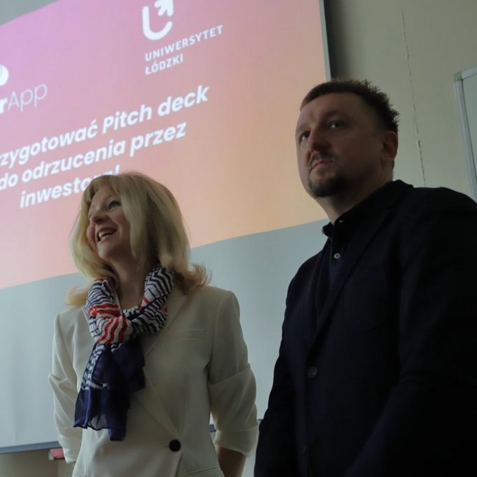 Presenter in front of the presentation