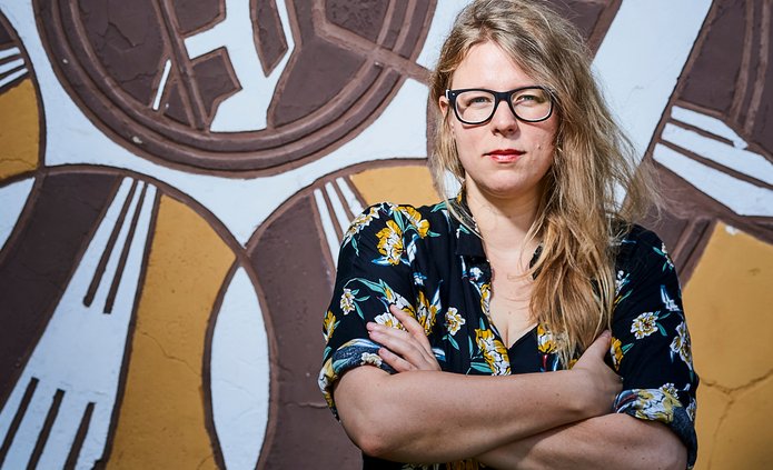 Maria Nowakowska on the background of a colourful wall