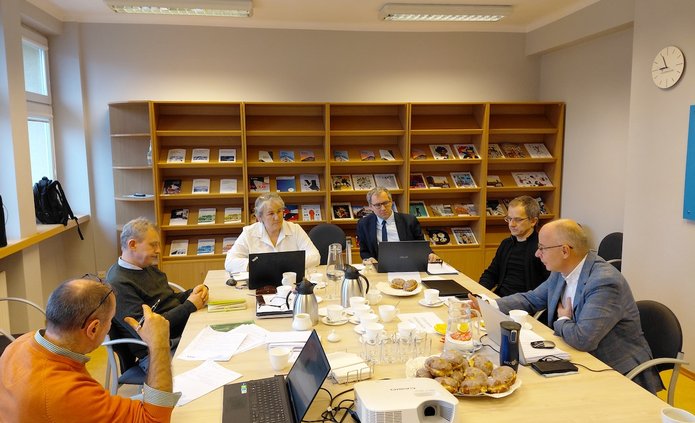 A group of scientists working at a table