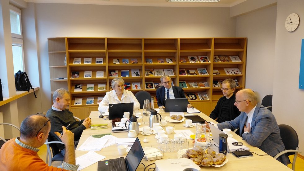 A group of scientists working at a table