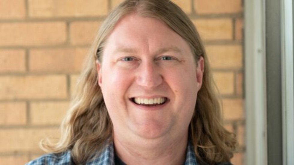 a portrait photo of Prof. Colby King