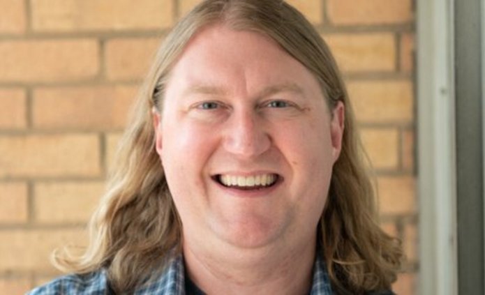 a portrait photo of Prof. Colby King