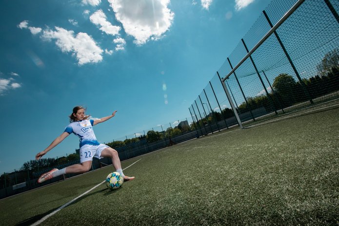 a woman playing football