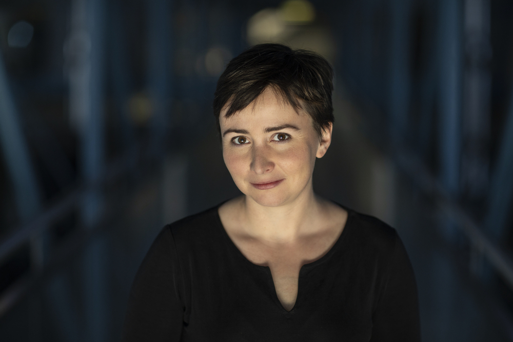 A portrait photo of Dr Agata Zysiak on a dark background