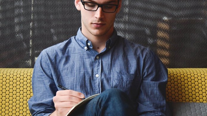 A man taking notes