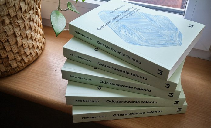 several of the author's books lying on the windowsill