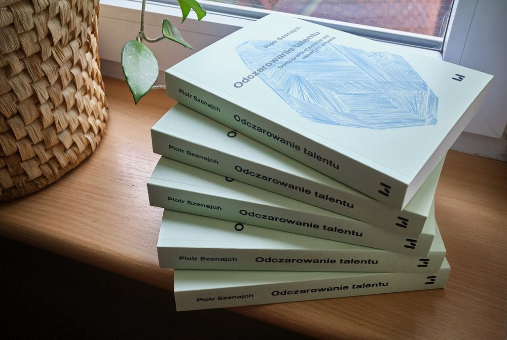 several of the author's books lying on the windowsill