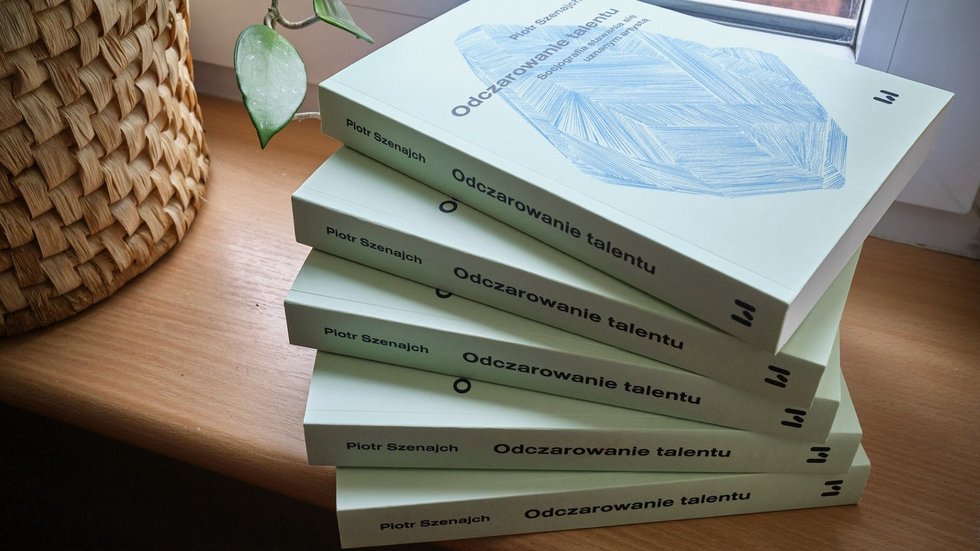 several of the author's books lying on the windowsill