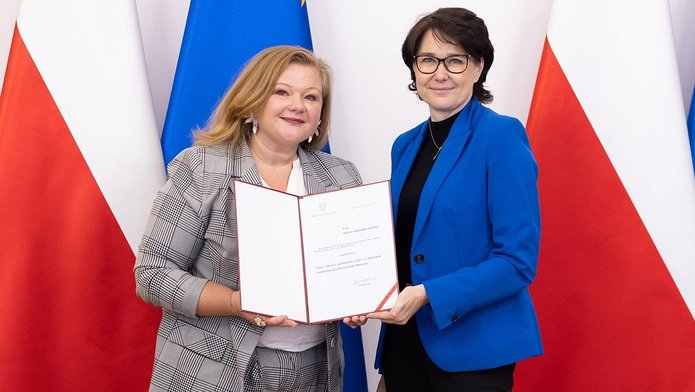 DTwo women holding the letter of appointment to the Legislative Council