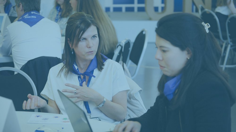 Two women who are talking to each other