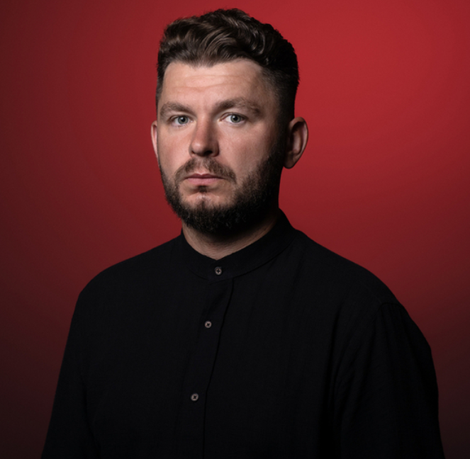 a portrait photo of Dr Dawid Kobiałka