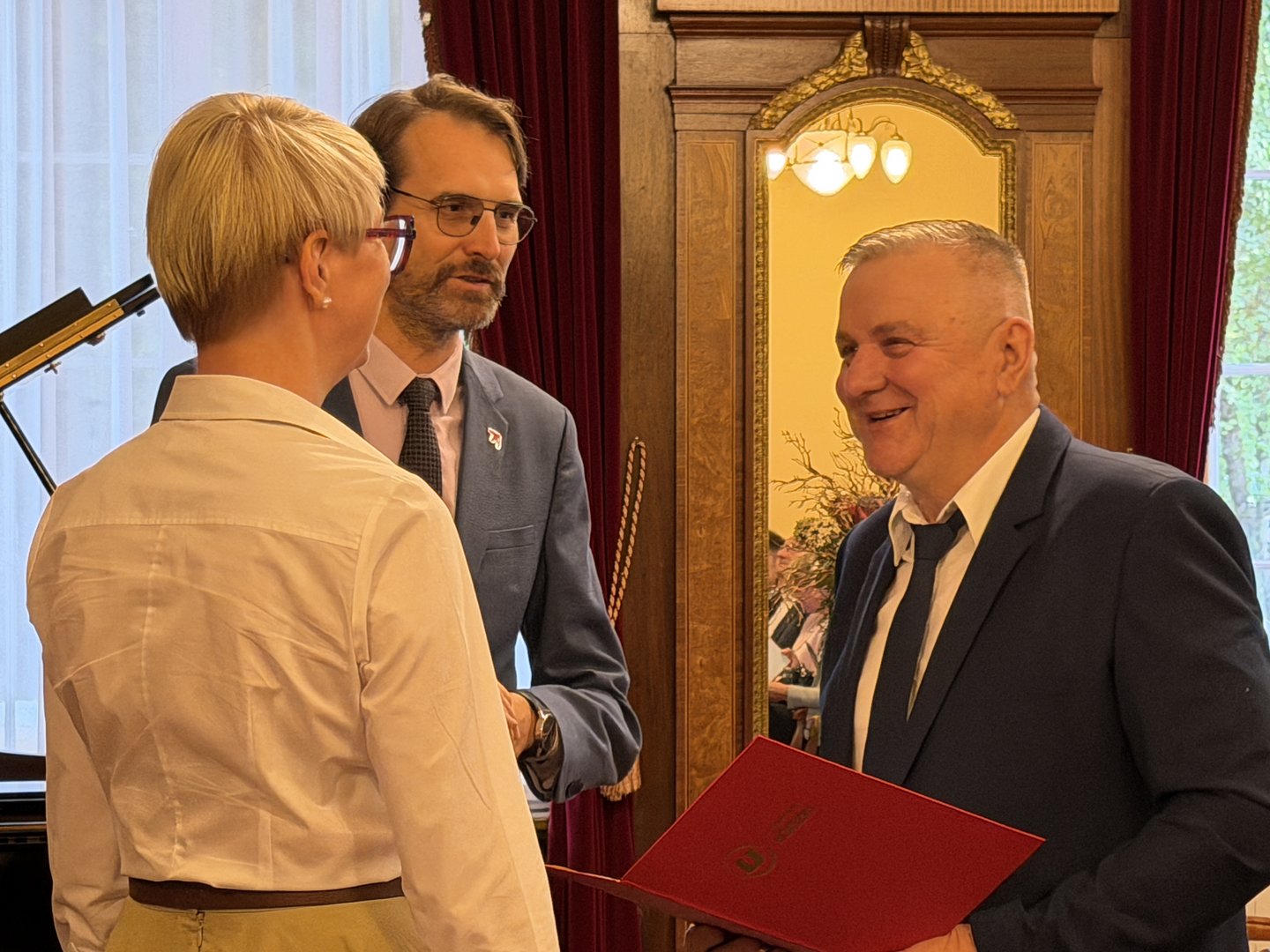 retired University of Lodz employee and the university authorities