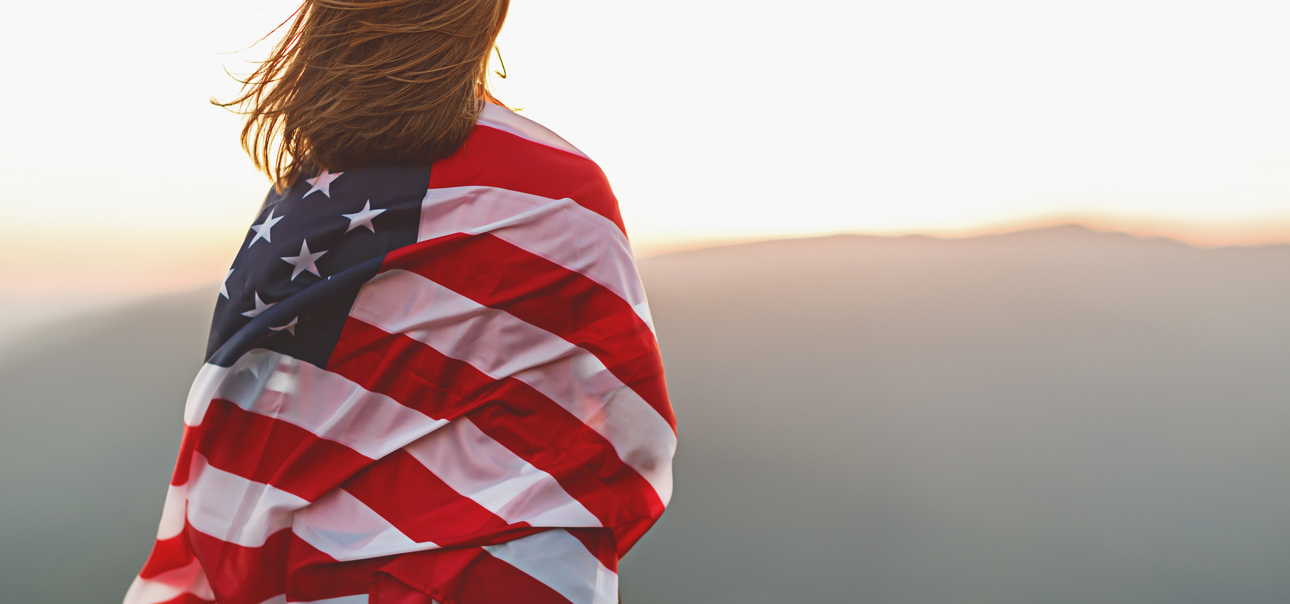 a woman with a flag of the United States