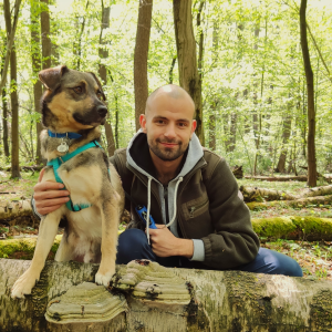 Mgr Sebastian Piskorski with a dog