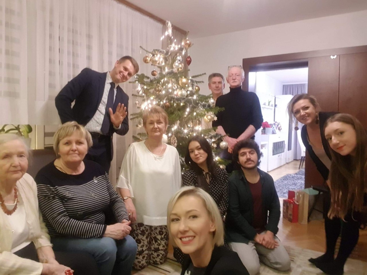 a group photo of a family taking part in the campaign with their international guests